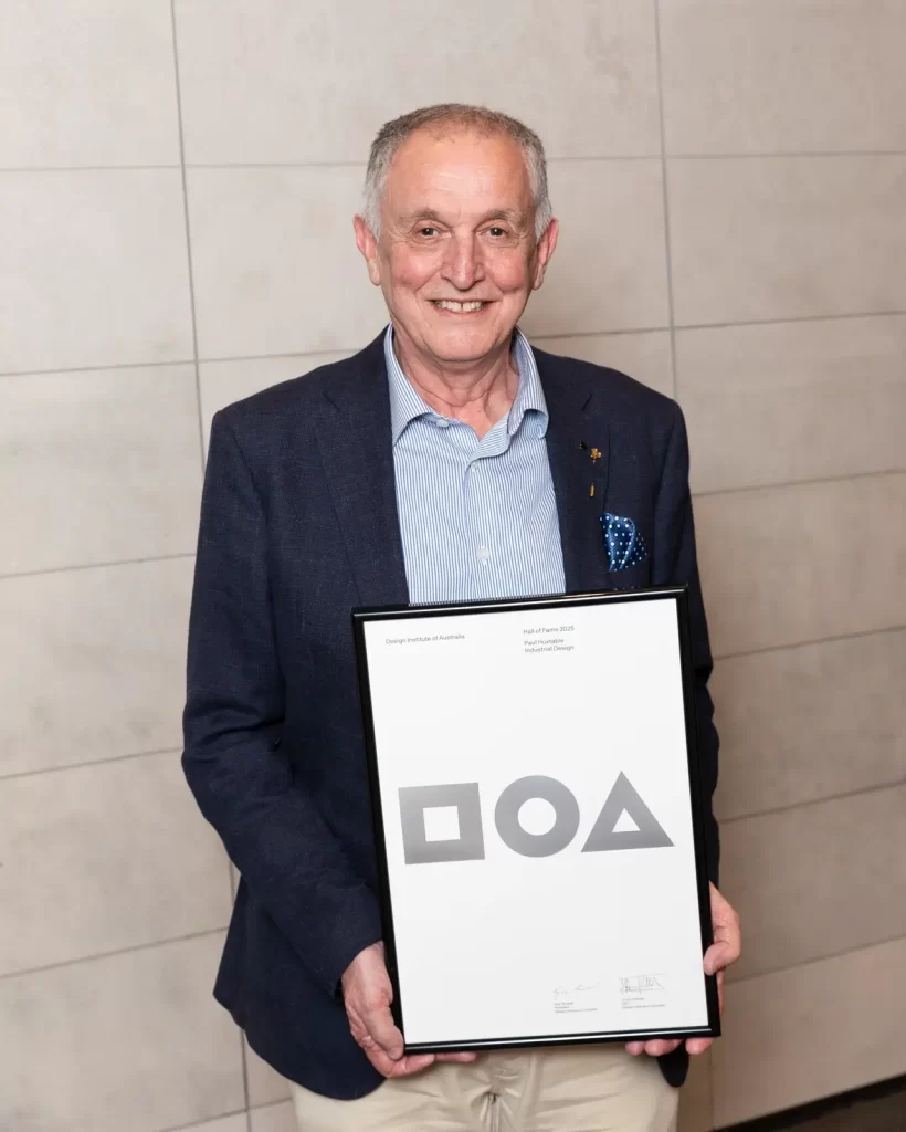 Paul Huxtable holding his award and the Design Institute of Australia Hall of Fame